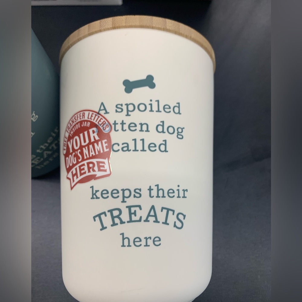 Customizable plastic dog treat jar with wooden cap.